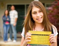 Girl holding report card